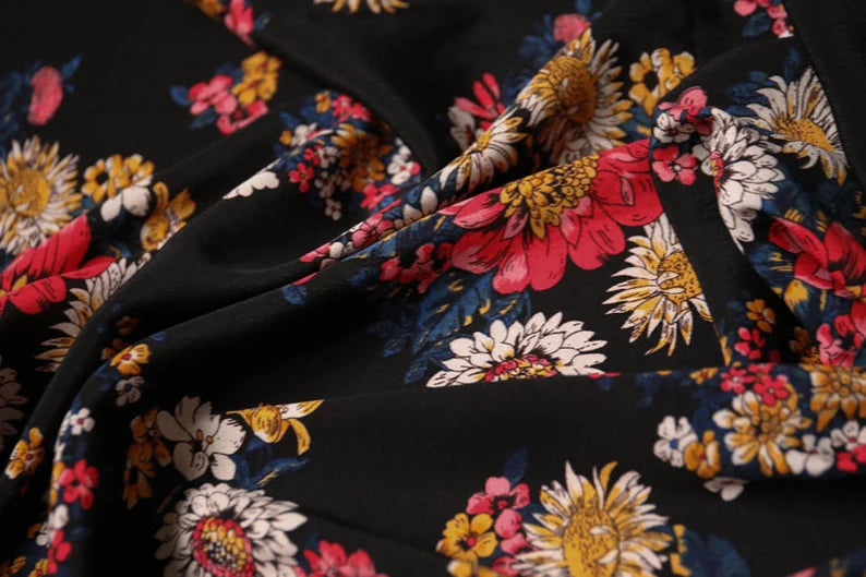 Sun flower on black Tencel crepe | PRICED PER METER